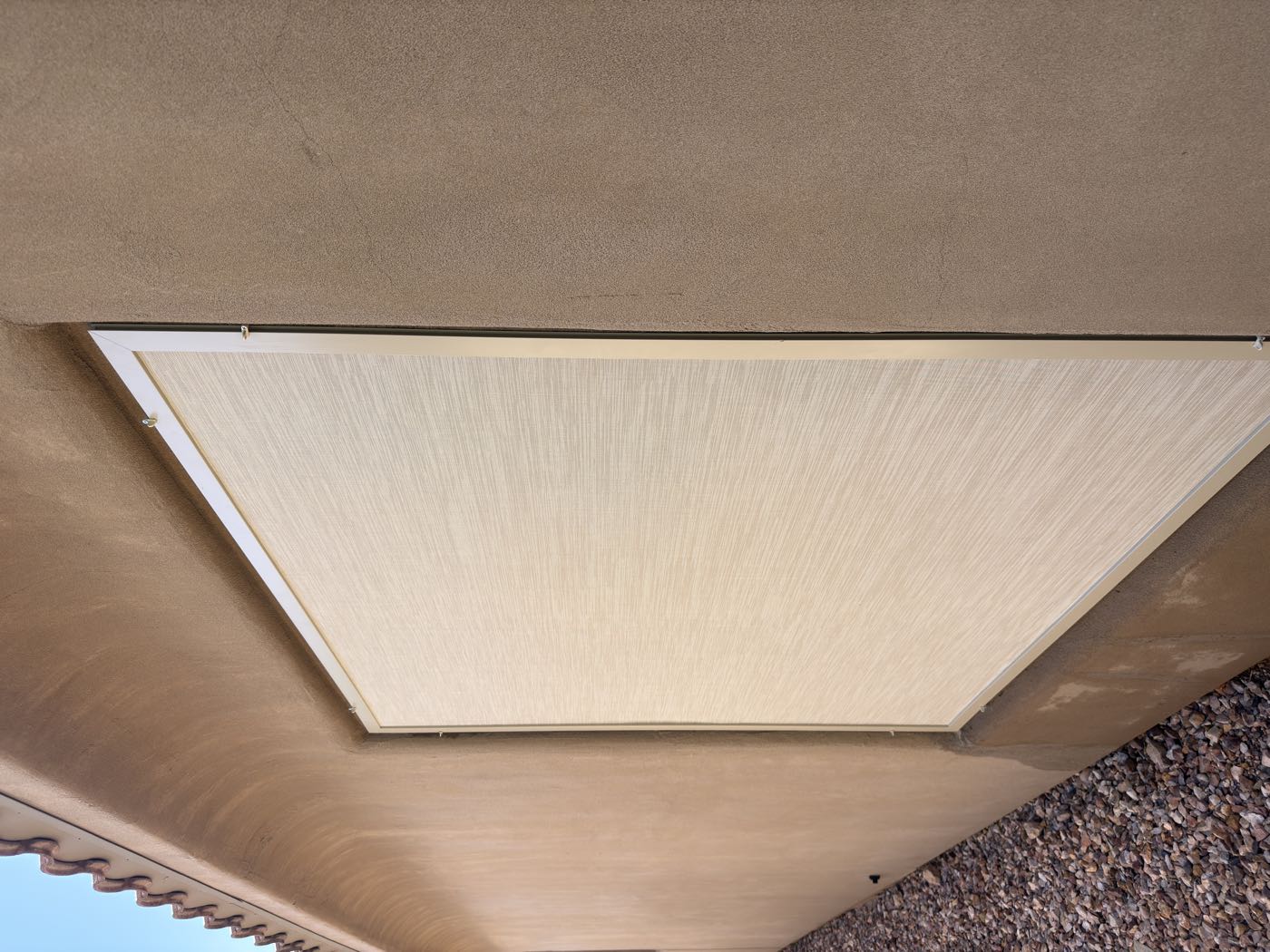 Close-up of a Desert Sand solar screen and its fitted frame
